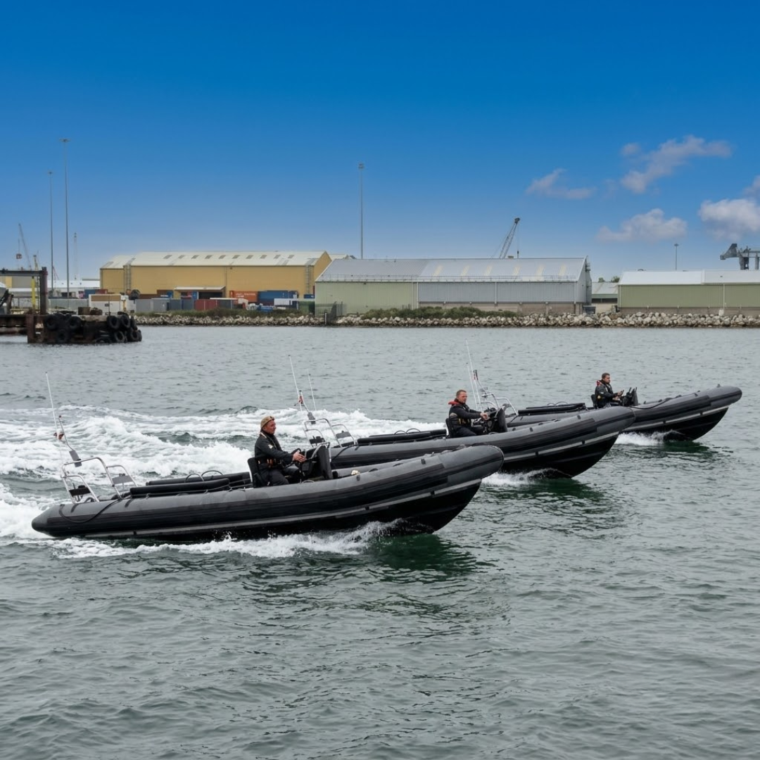 Three black safety boats from the DC Transport marine division operating rapidly in coastal waters.